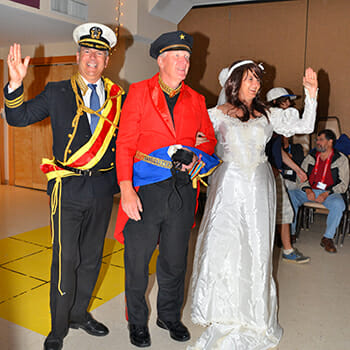 Andy Cesnickas (center) dressed as a naval officer to amuse camp attendees.