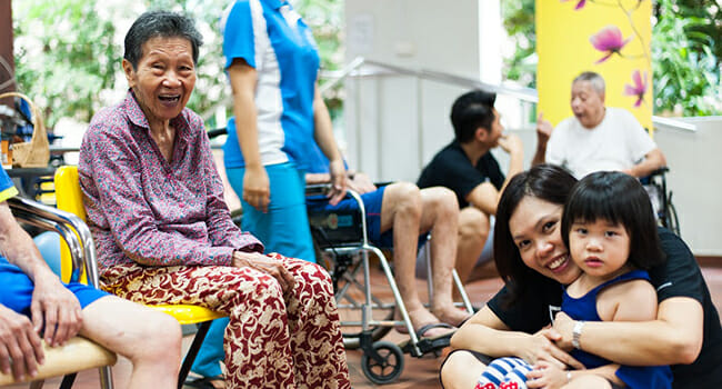 Groupon volunteers in Singapore spend time with the folks at Chee Hoon Kog Moral Promotion Society, a senior living facility.