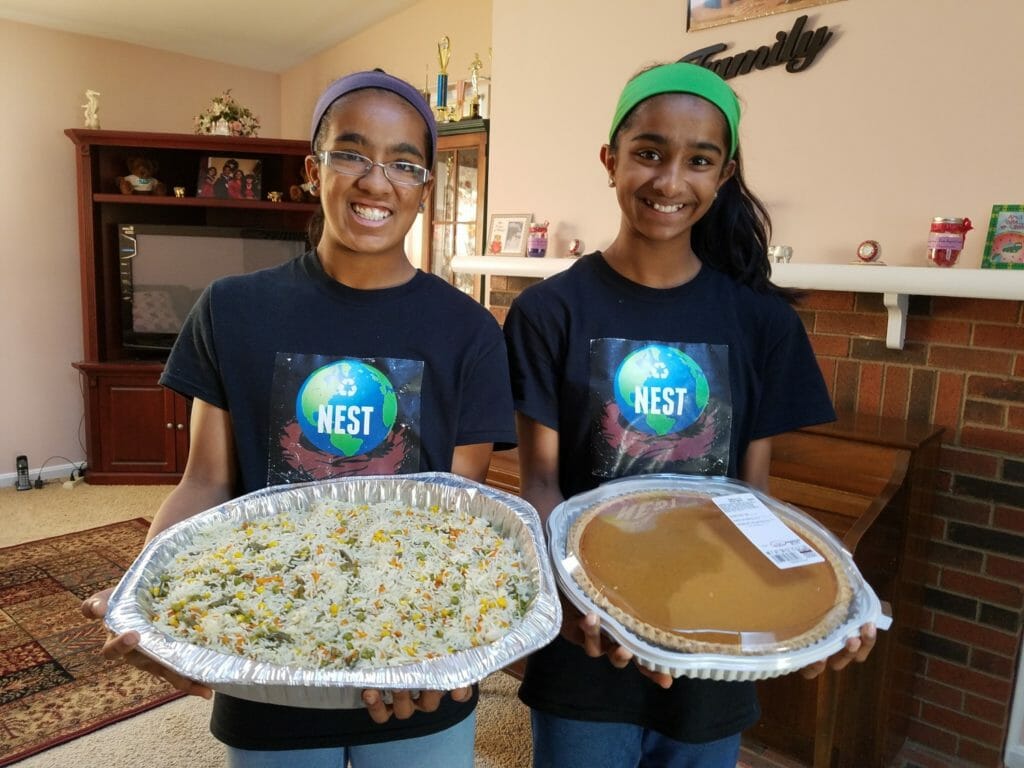 Shreyaa (left) and Esha (right) excited and ready to serve Thanksgiving Feast to the homeless community in Washington D.C./ Courtesy Shreyaa & Esha Venkat