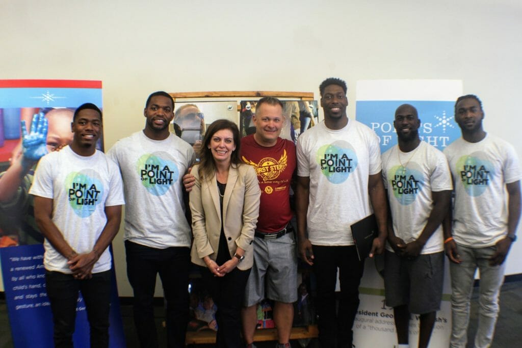 (left to right) Coty Sensabaugh, Sam Barrington, Points of Light CEO Tracy Hoover, Scott Van Duzer, Jared Cook, Michael Thomas, and Jonathan Meeks pictured after Jared Cook was awarded with a Presidential Volunteer Service Award.