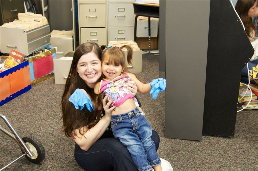 Melissa Hirsch volunteers with HandsOn Broward's youngest volunteer