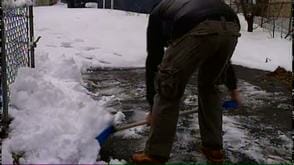 Volunteer Shovels Snow. Credit NBC 10 News