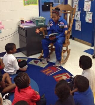 Taylor reading to students at a local Jacksonville, FL elementary school.