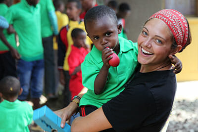 Mallory Brown delivering clothes to an orphanage in Ethiopia.