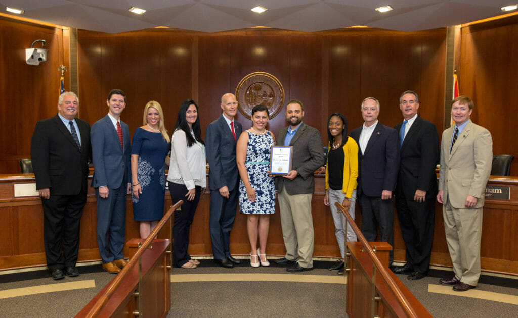 Members of HandsOn Orlando accepting Champion of Service Award from Gov. Rick Scott and Volunteer Florida CEO Chester Spellman.