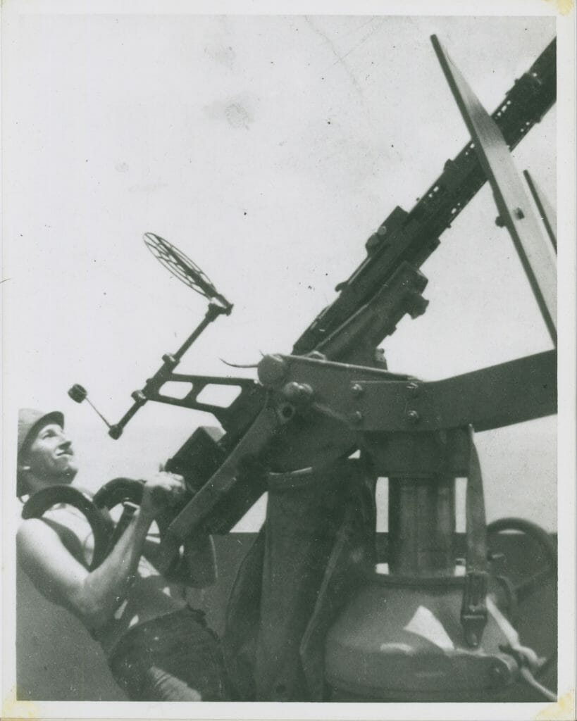 Daniel Kelly operating a turret aboard naval ship during WWII.
