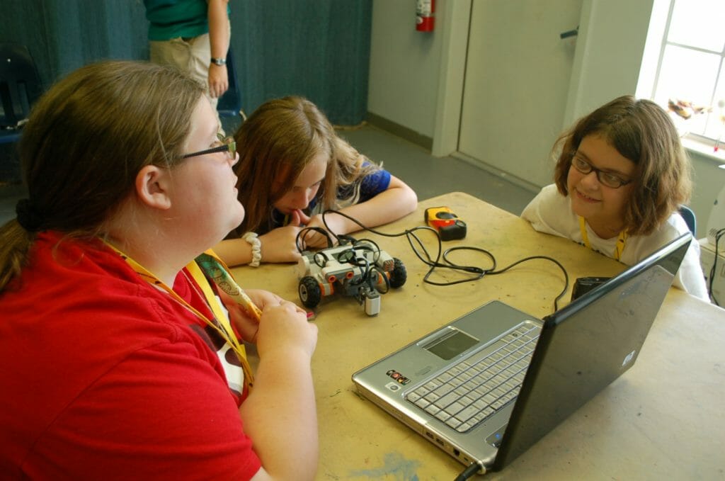 The Girl Scouts of San Jacinto Council working together at a robotics meeting