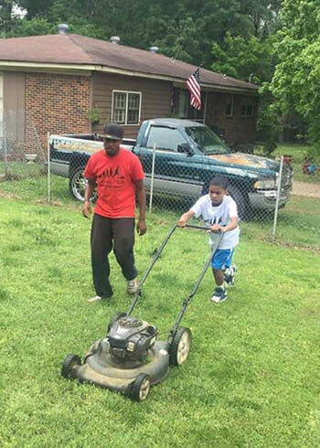 Rodney Smith and young volunteer hard at work.