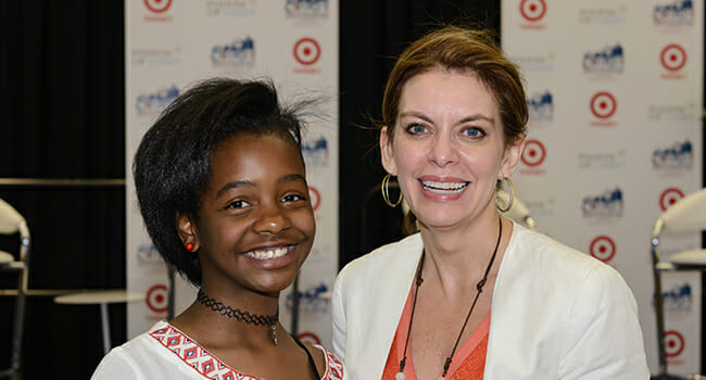 Asia Newson, CEO of Super Business Girl and Detroit's youngest entrepreneur, and Tracy Hoover after speaking at the business track opening at the Conference on Volunteering and Service.