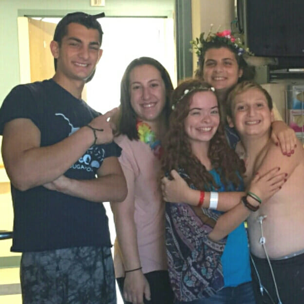 Amara Riccio and her Friendly Ability Volunteers sang, joked and spent time with a patient this past summer.