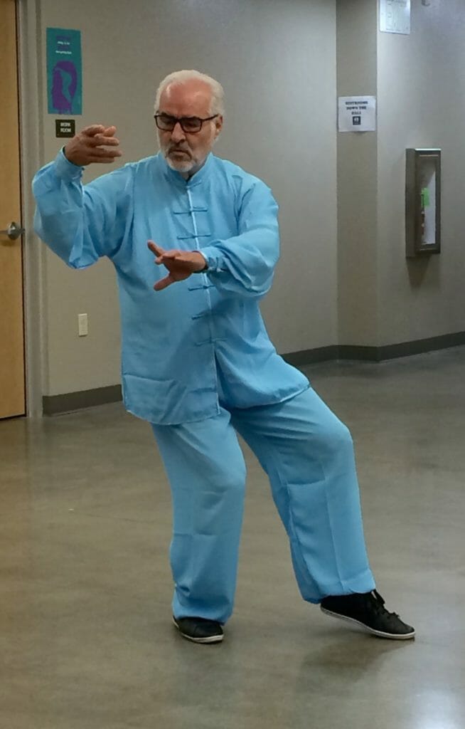 Arthur M. Lopez demonstrating Tai Chi moves.