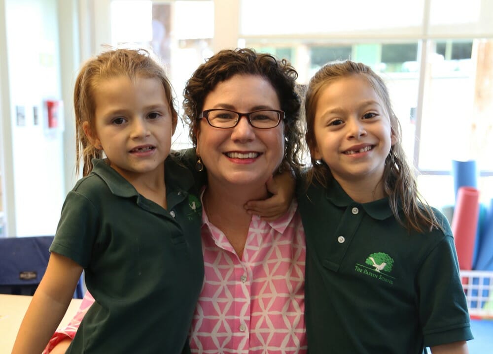 Laurie Gutierrez with Addie (left) and Sofia (right), students at The Parish School.