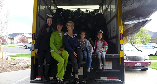 Shelly Gonzales (center) and her daughters Gabby and Avery (respectively, far right) posed alongside Miss Utah 2014 Karlie Major and her mother, Stephanie, at a shoe drive led by the Miss America pageant.