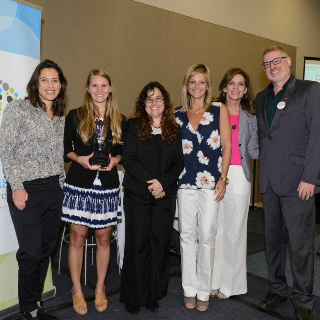 Ruach Tova receiving the George W. Romney Excellence Award, with Points of Light CEO Tracy Hoover and Alison Doerfler, Executive Director of HandsOn Network.