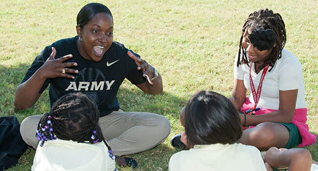 At a service project in Washington, D.C., veterans shared their stories of service with local elementary school students. With help from the veteran volunteers, the students recorded and illustrated these stories, creating books to be given to the children of deployed soldiers.