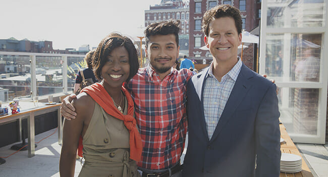 Hasbro Chairman, President & CEO Brian Goldner, right, with Bryony Bouyer, SVP Global Category Management, Marketing and Creative, left, with Peter Khoy, Coordinator, Retail Activation and graduate of the company’s Transforming Talent program. 