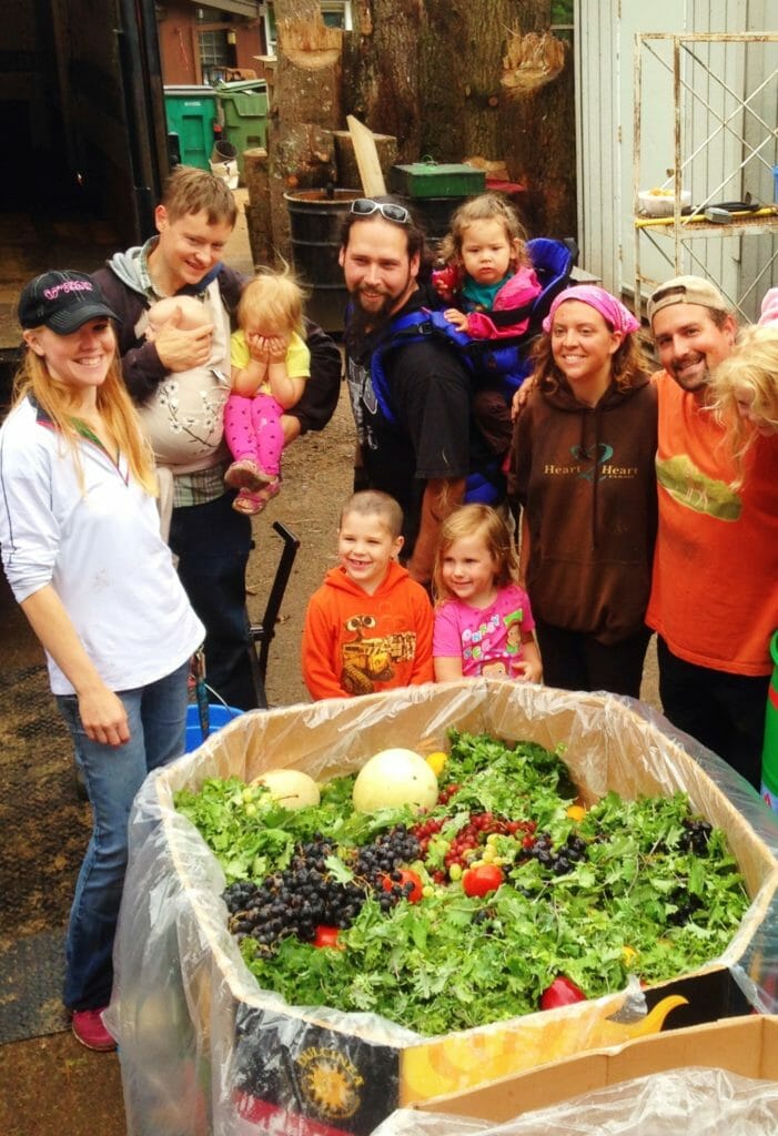 The Good Neighborhood Family Pantry opens up the gleaning event for the day. Elizabeth pictured third from right./Courtesy Elizabeth Boggs