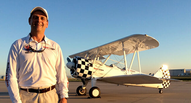 Tim Newton in front of one of AADF’s Stearman biplanes/ Courtesy Tim Newton and AADF