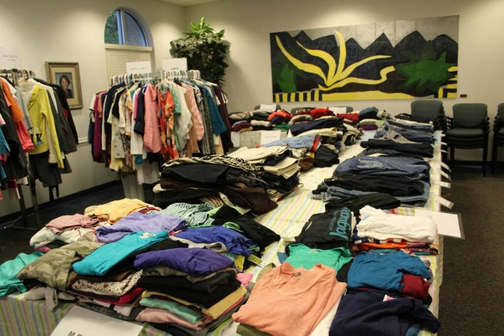 Volunteers organize clothing on racks for Ms. Mary’s Boutique./Courtesy PACE Center for Girls of Jacksonville