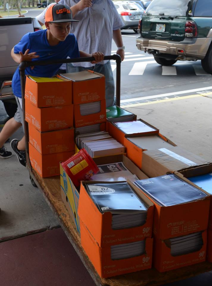 Volunteers deliver notebooks to a Bunco for Backpacks event./Courtesy Deborah Shackowsky