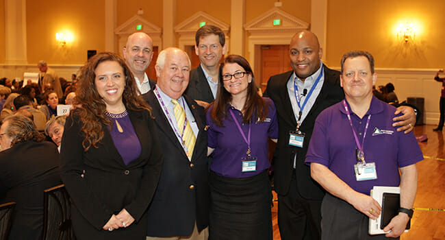 Points of Light recognized the volunteers of the Project Management Day of Service Program Management Office, with a Daily Point of Light Award for their efforts organizing the Day of Service. (Left to right) Laura Barnard, Michael Hannan, John Cable, J. Kendall Lott, Joelle Kunkel, Marcus Parker, and Bob Ehrlich.