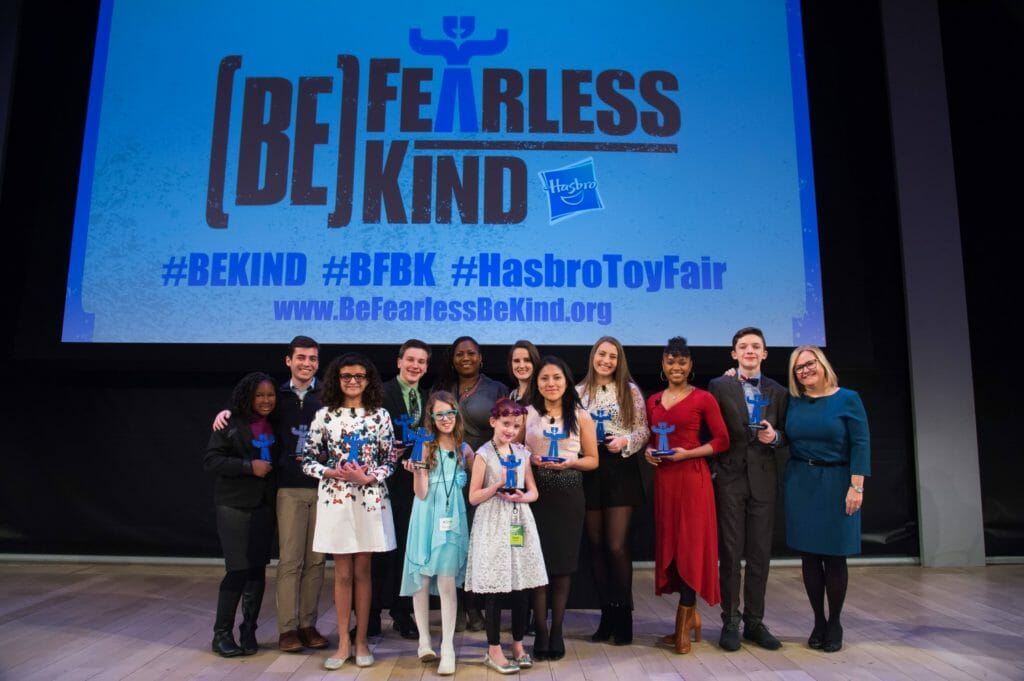Hasbro Community Action Heroes were honored at the company's New York Toy Fair. Back (l to r): Zoe Terry, Josh Kaplan, Zachary Rice, Terra Gay and Sarah Fanslau of generationOn, Morgan Guess, Eden Duncan-Smith, Aidan Anderson, and Karen Davis of Hasbro. Front (l to r): Paloma Rabana, Hailey Richman, Violet Humble, Angelina Zevallos.
