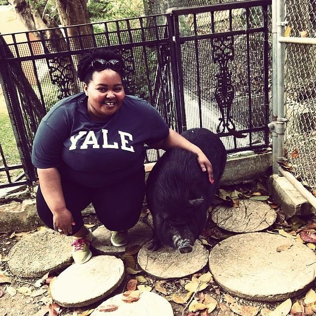 Shaterri Casteel  with Gloria the pig during a rescue partner site tour of a pet sanctuary in Puerto Rico.
