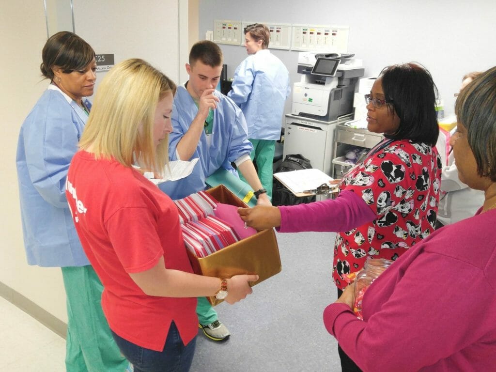 Jaime Waterbury with Winn Army Community Hospital staff./Courtesy Kaytrina Curtis.