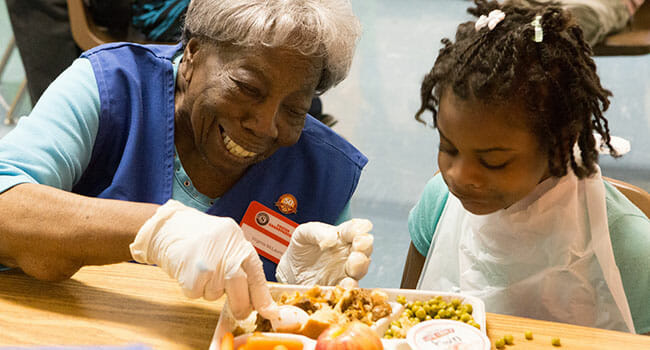 Senior Corps Foster Grandparent Virginia McLaurin volunteers at a school in Washington, D.C. 