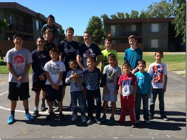 Adam Grabowski (back row, first from left) and volunteers from the Vacaville Christian High School basketball team pictured with camp attendees after practice./Courtesy Adam Grabowski 