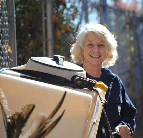 Barbara delivering fresh water to wolf enclosures at the Wolf Conservation Center./Courtesy Barbara Mignano