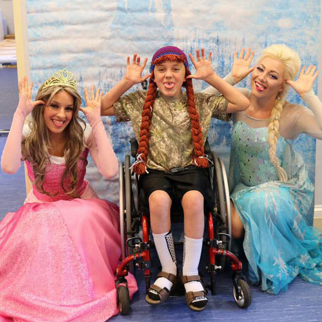 Volunteer Ashley Clayton, as Princess Aurora, and Kylee visit the Children's Inn at NIH in Bethesda, Md.