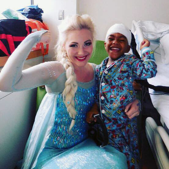 Kylee McGrane, founder of A Moment of Magic, visits Cohen Children's Medical Center in New York.