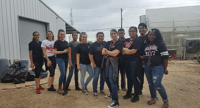Rebecca Ayala (front) with a group of students who volunteered at the San Antonio Food Bank.