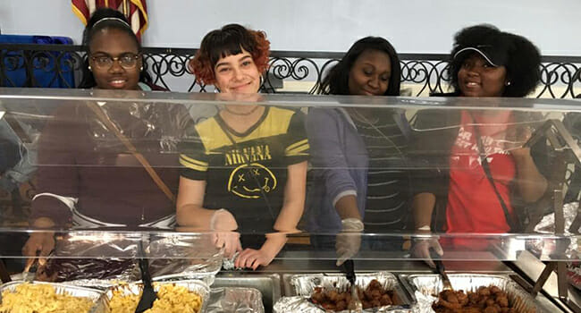 ServiceWorks participants from St. Louis County Youth Programs’ Leadership and Resiliency Program serve BBQ meatballs and macaroni and cheese at a local homeless shelter.