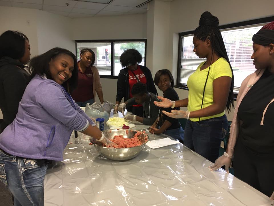 Service scholars from St. Louis County Youth Programs’ Leadership and Resiliency Program make meatballs for Gateway 180, a local homeless shelter.