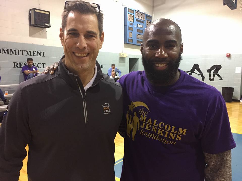 Paul Isenberg with Malcolm Jenkins of the Philadelphia Eagles. Through Bringing Hope Home, every holiday season the Malcolm Jenkins Foundation donates Christmas dinners to 10 families who are fighting cancer. 