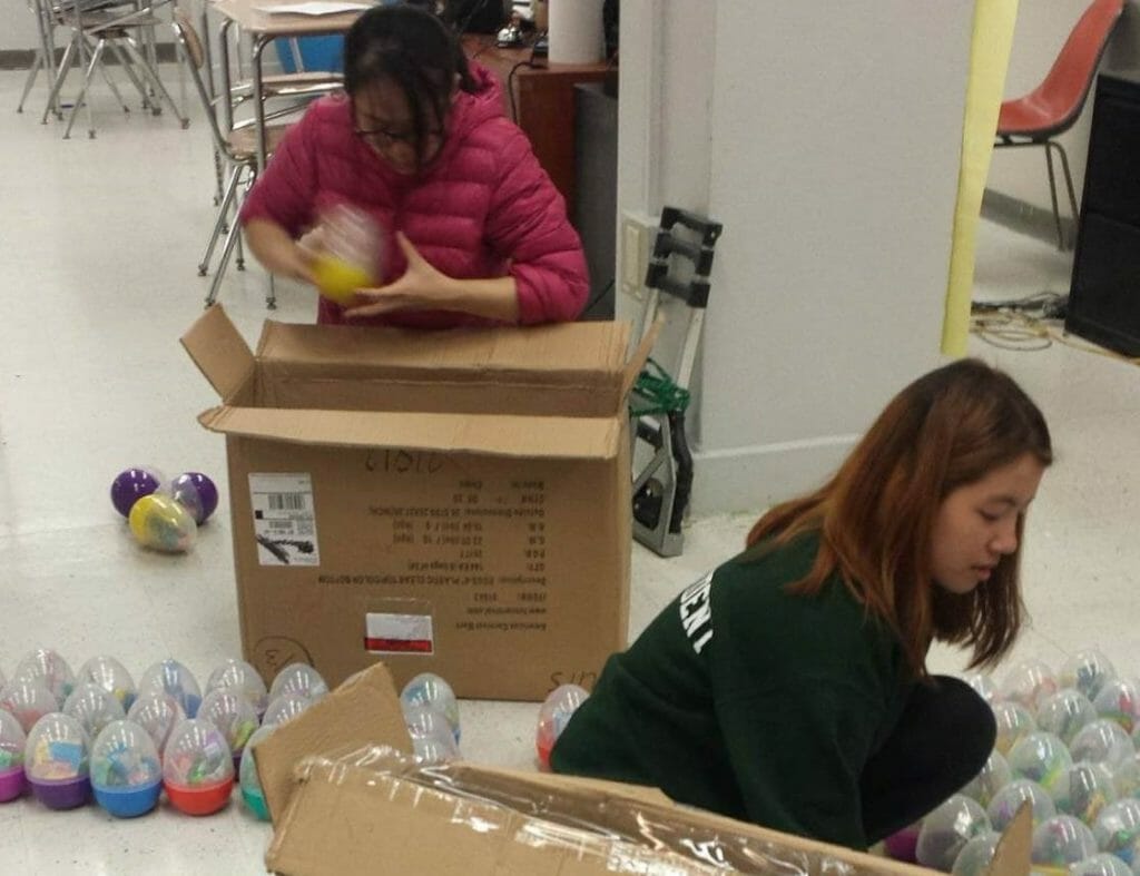 Shannon Li packing candy-filled Easter eggs for a Cookies for Cancer fundraiser./Courtesy Shannon Li