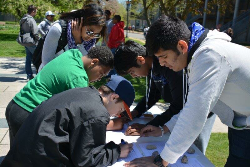 Chintan (right) volunteering as a math tutor during an event at the Detroit Zoo./Courtesy Chintan Maheshwari