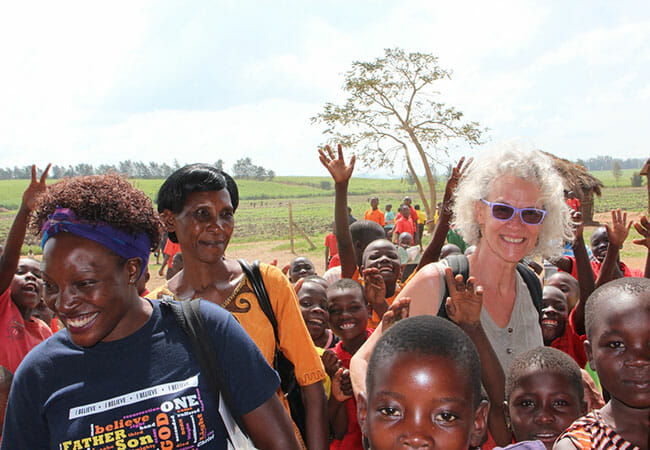 Ellie (right) pictured with two women who run sewing guilds that produce reusable MoonCatcher pads in Uganda./Courtesy Ellie von Wellsheim