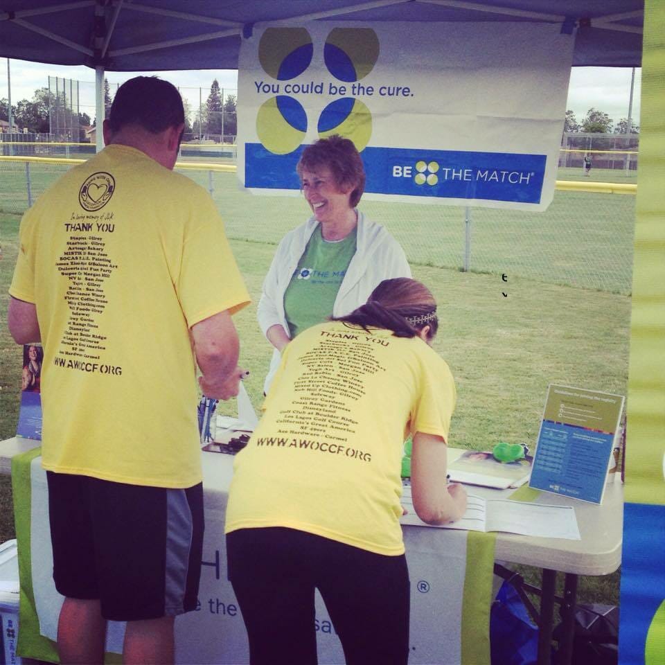 Marcia registering two possible donors at a Be the Match drive in California./ Courtesy Marcia Diefendorff