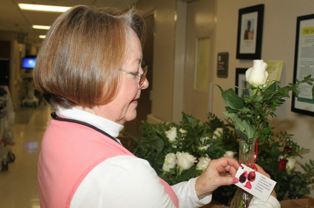 Mary Jane delivering flowers to hospital patients on Valentine’s Day. /Courtesy Palmetto Health Richland Hospital