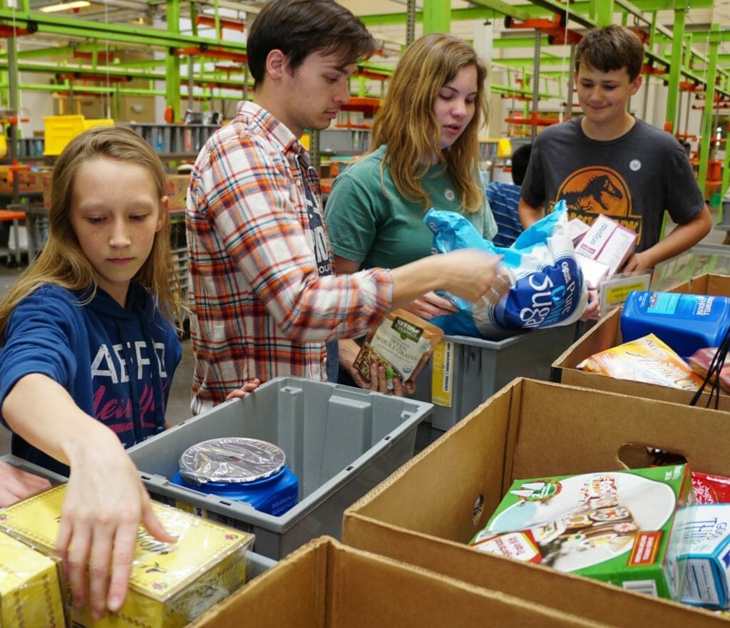 Photograph of Houston Food Bank volunteers sorting food, shot by Jill Lefforge./Courtesy Jill Lefforge