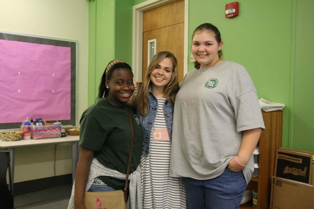 Natalie Flanders (middle) pictured with Girls Grow participants./Courtesy Natalie Flanders
