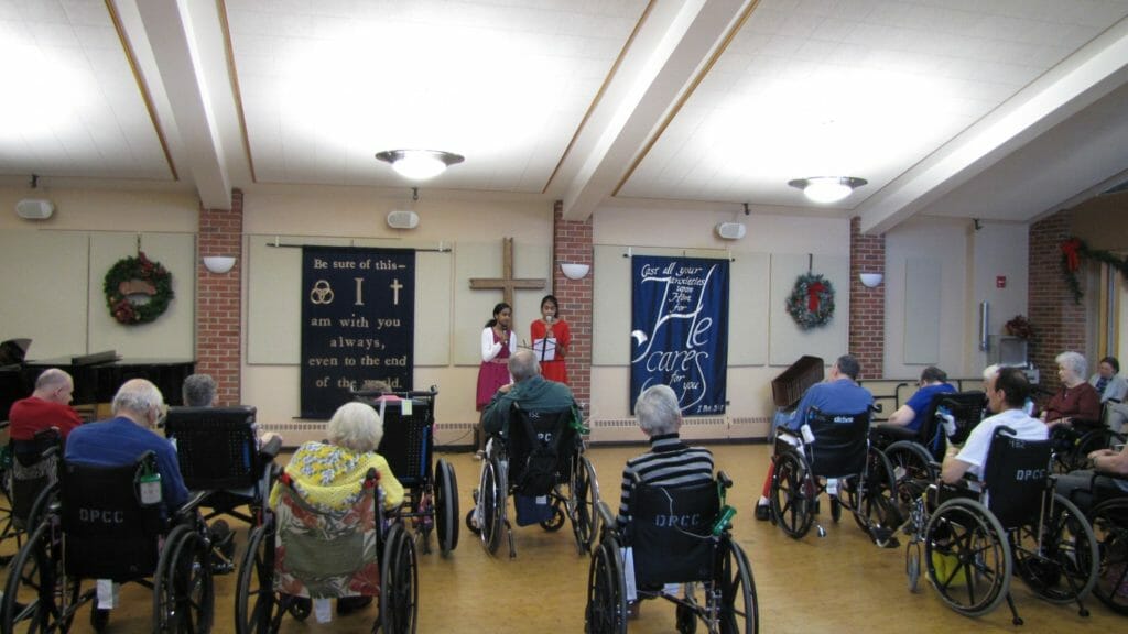 Sanjana (right) and her sister, Nathra, perform at a local nursing home./Courtesy Sanjana Ramrajvel