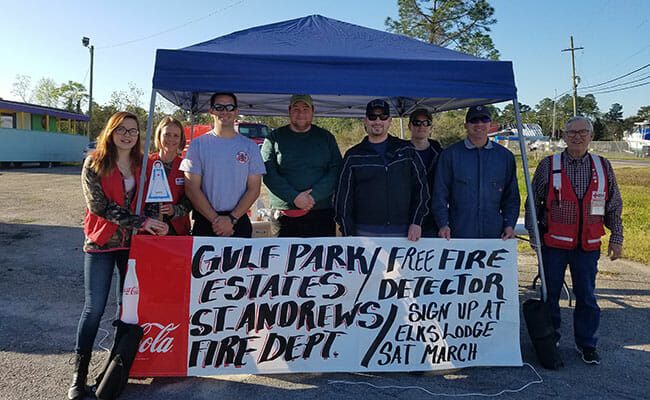 Volunteers manage sign-ups for free fire detector installations through the Home Fire Campaign in rural Jackson County.