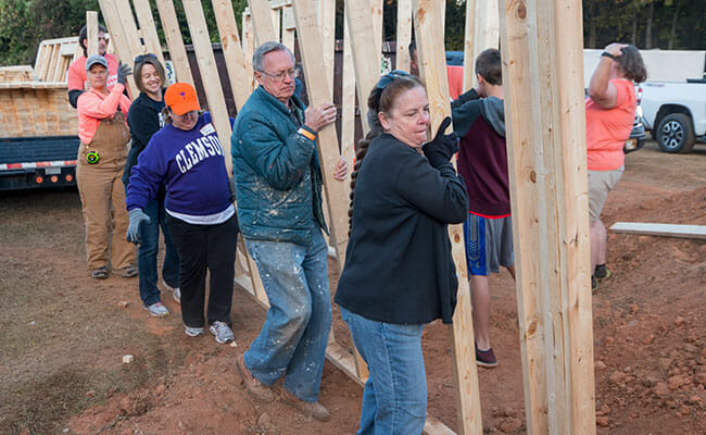 On Make A Difference Day 2016, the Dream Center organized 500 volunteers to construct 13 tiny houses for homeless residents of Pickens County, South Carolina.