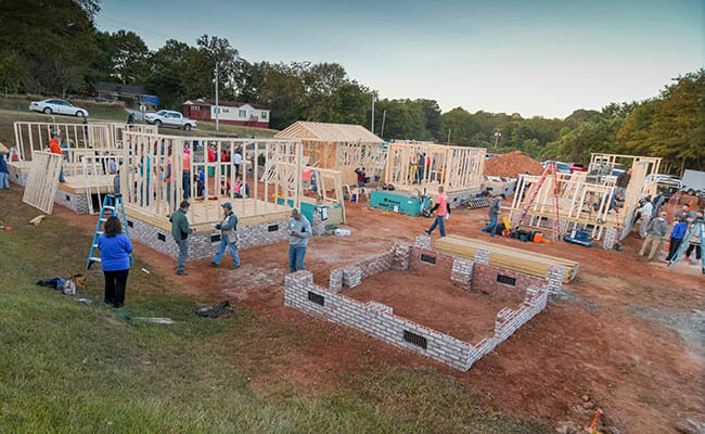 On Make A Difference Day, volunteers began construction on Opportunity Village, building the first 13 tiny houses. Since then, another 10 homes have been built.