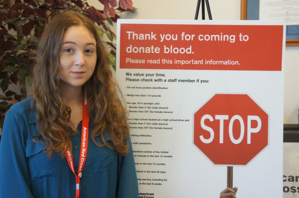 Jenna volunteering at the Red Cross where she helps run the registration table during blood drives./Courtesy Jenna Baurer