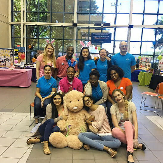 Alicia Nelson (bottom right) and National Health Corps volunteers at a community baby shower at UF Health Jacksonville./Courtesy Alicia Nelson 